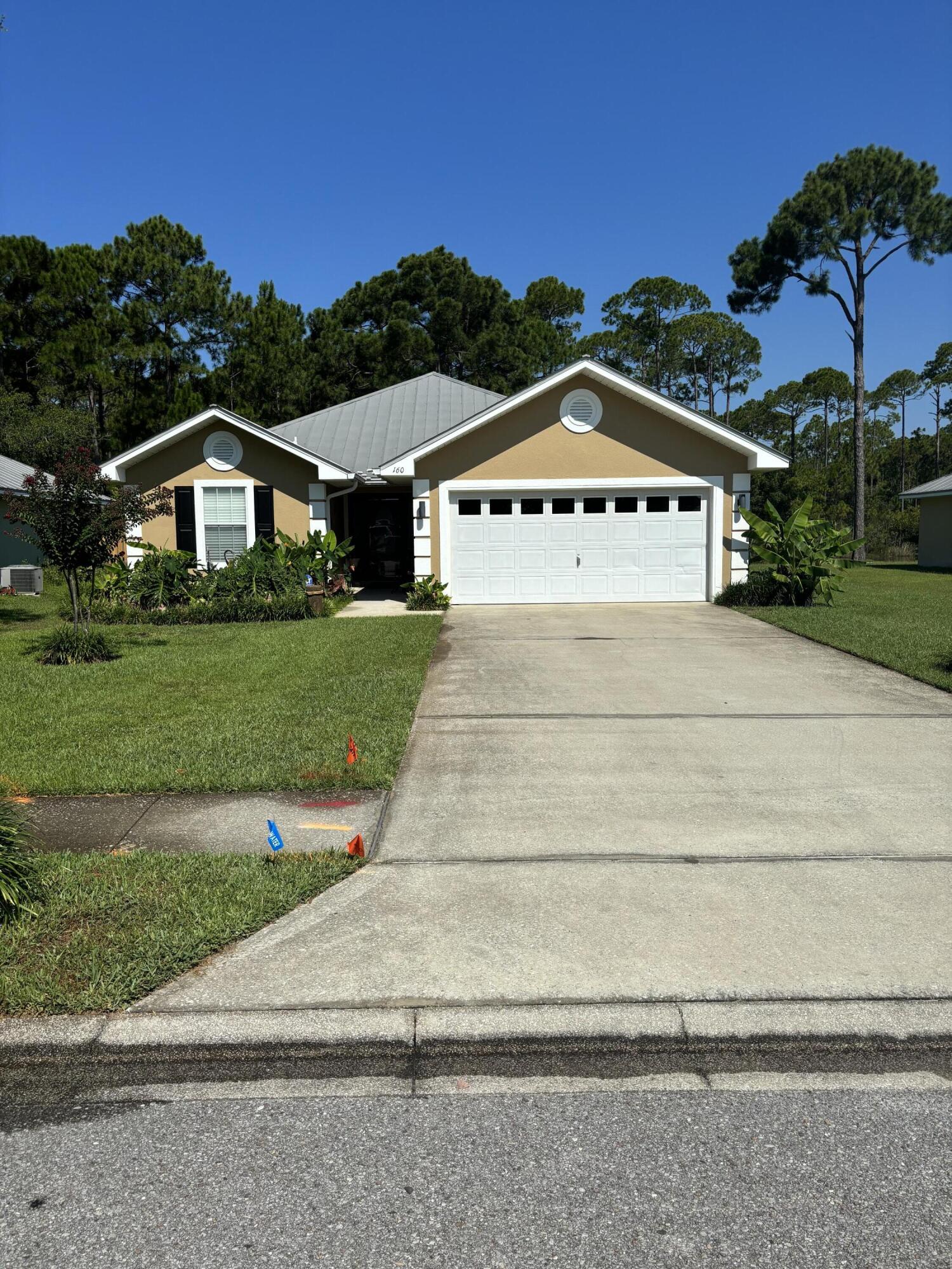 160 South Harborview Road Santa Rosa Beach, FL 32459 - Photo 1 of 20 a view of house with a yard and potted plants