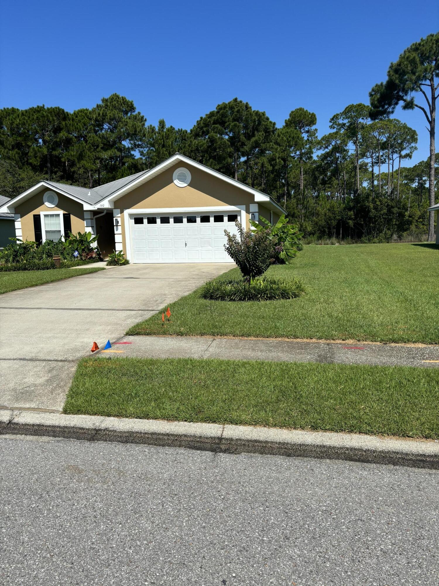 160 South Harborview Road Santa Rosa Beach, FL 32459 - Photo 3 of 20 a view of a house with a yard