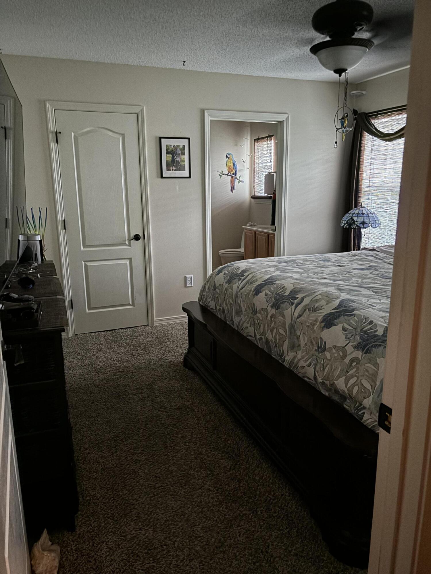 160 South Harborview Road Santa Rosa Beach, FL 32459 - Photo 6 of 20 a bedroom with a bed and a mirror