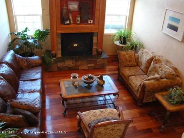 136 Native Springs Drive Rifle, CO 81650 - Photo 19 of 42 a living room with furniture and a fireplace