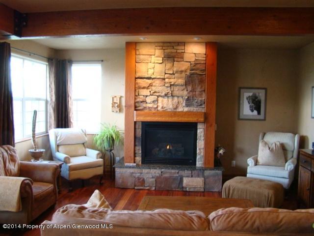 136 Native Springs Drive Rifle, CO 81650 - Photo 29 of 42 a living room with furniture and a fireplace