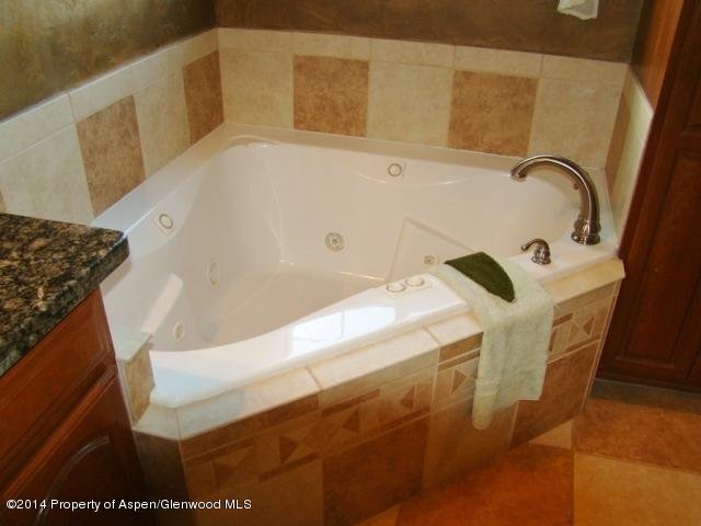 136 Native Springs Drive Rifle, CO 81650 - Photo 36 of 42 a bathroom with a bathtub