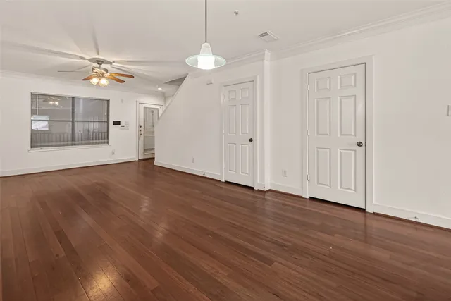 a front view of building with large trees