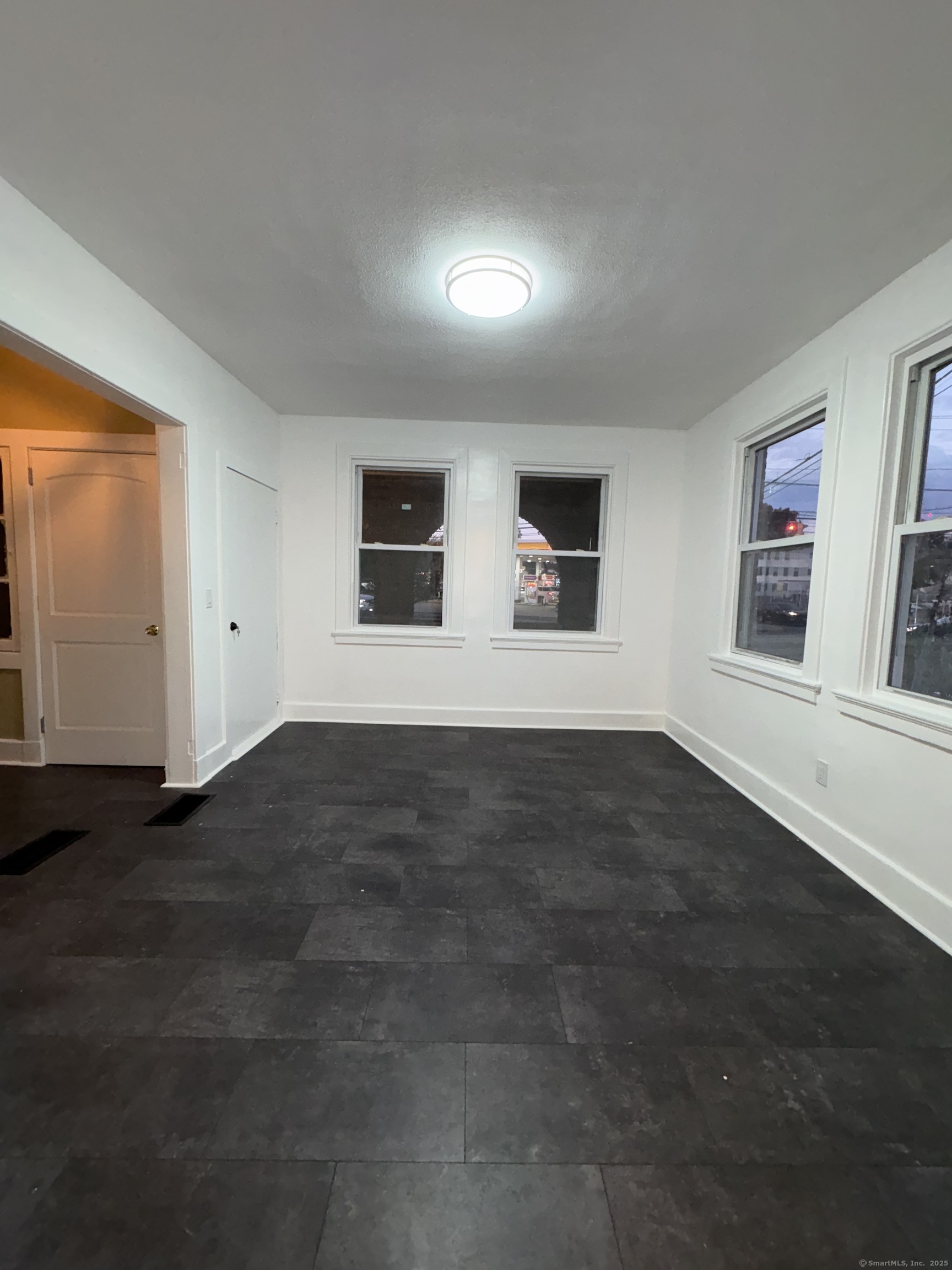 1922 Boston Avenue Bridgeport, CT 06610 - Photo 11 of 31 a view of empty room with wooden floor and fan