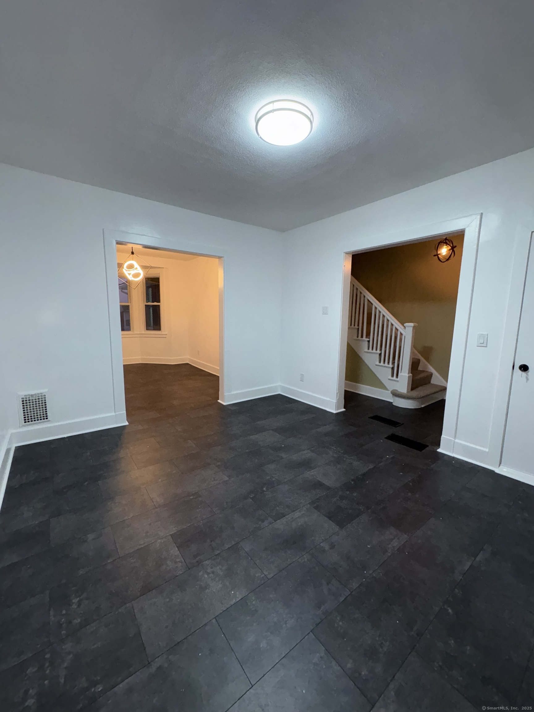 1922 Boston Avenue Bridgeport, CT 06610 - Photo 12 of 31 an empty room with windows and fireplace