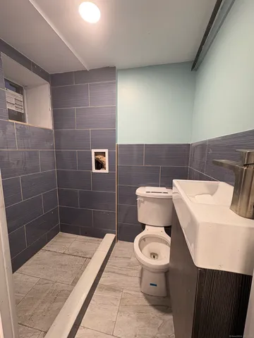 a bathroom with a toilet and a sink