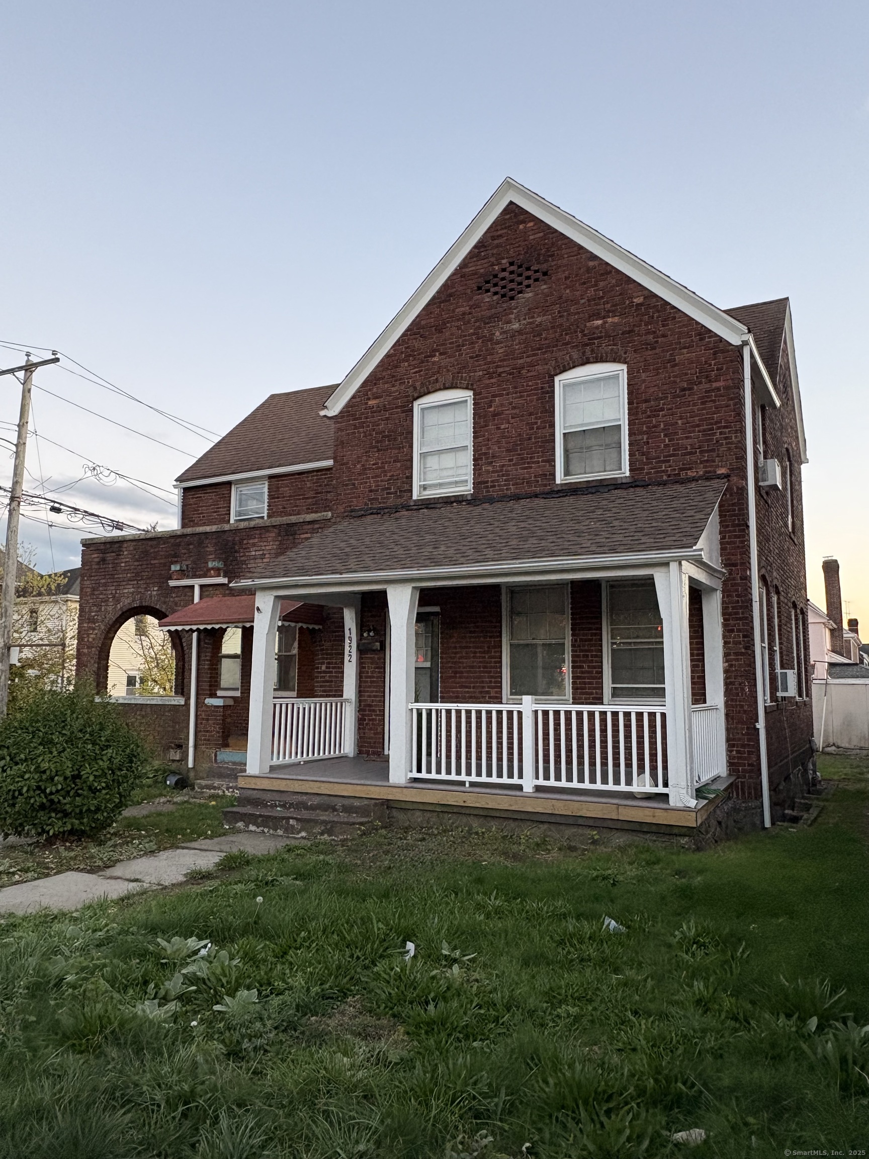 1922 Boston Avenue Bridgeport, CT 06610 - Photo 3 of 31 a front view of a house with garden