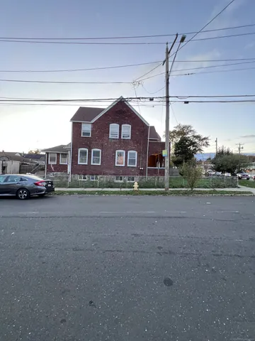 a view of a car parked in front of a building