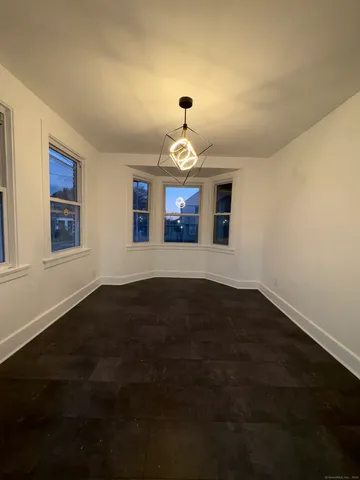 a kitchen that has a stove and a window
