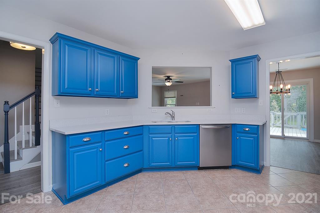4306 Atkinson Way Monroe, NC 28110 - Photo 12 of 31 a kitchen with stainless steel appliances granite countertop wooden cabinets a sink and dishwasher