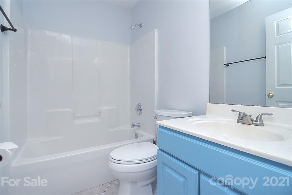 4306 Atkinson Way Monroe, NC 28110 - Photo 13 of 31 a bathroom with a sink a toilet and a bathtub