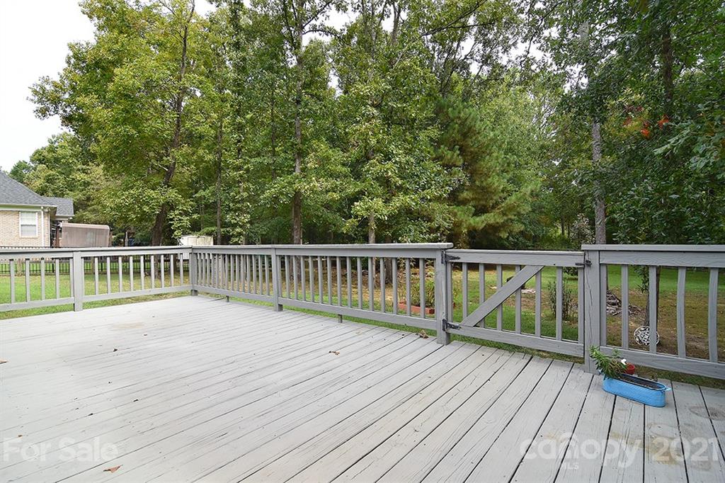 4306 Atkinson Way Monroe, NC 28110 - Photo 27 of 31 a balcony with wooden floor and fence