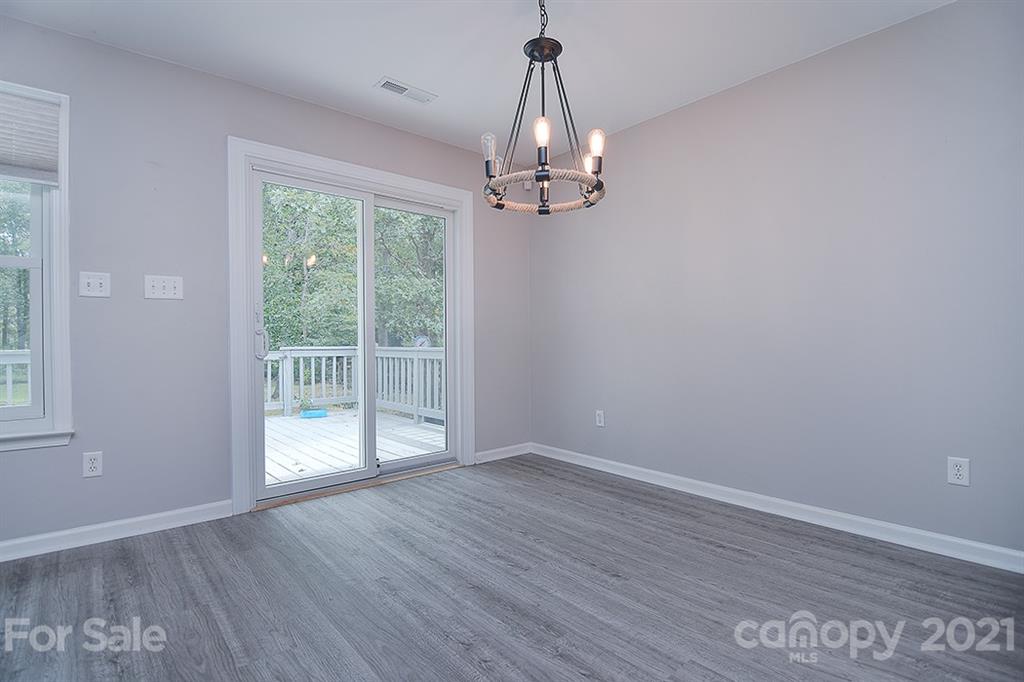 4306 Atkinson Way Monroe, NC 28110 - Photo 7 of 31 a view of empty room with wooden floor and fan