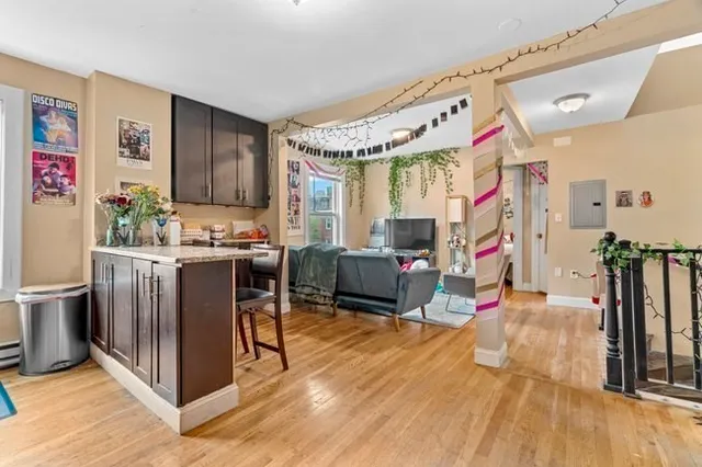 a living room filled with furniture and a flat screen tv