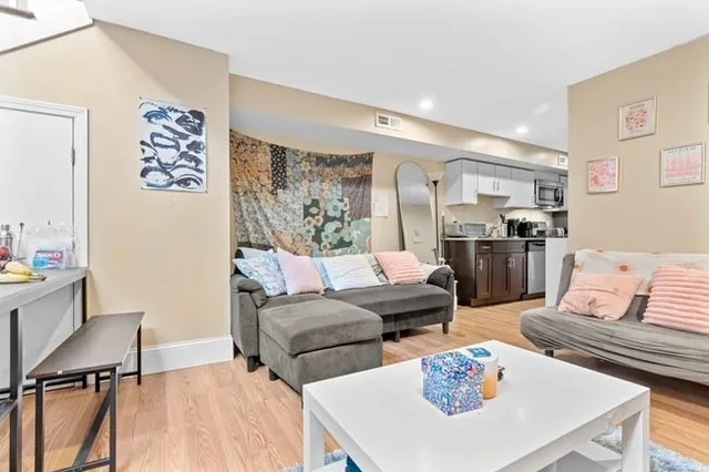 a living room with furniture and a table