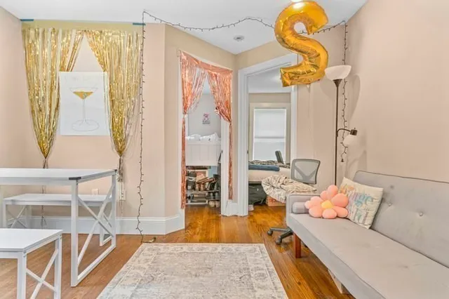 a living room with furniture and a table