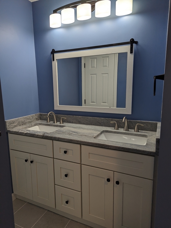 514 Old County Road Holland, MA 01521 - Photo 23 of 40 a bathroom with a sink and a mirror