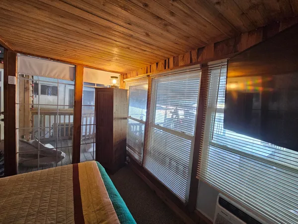 a balcony view with a glass door