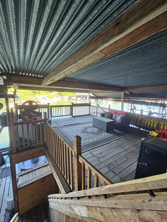 a view of a balcony with furniture
