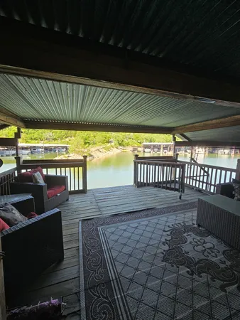 a view of a porch with wooden floor