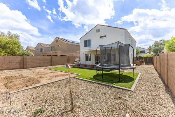a house view with a backyard space