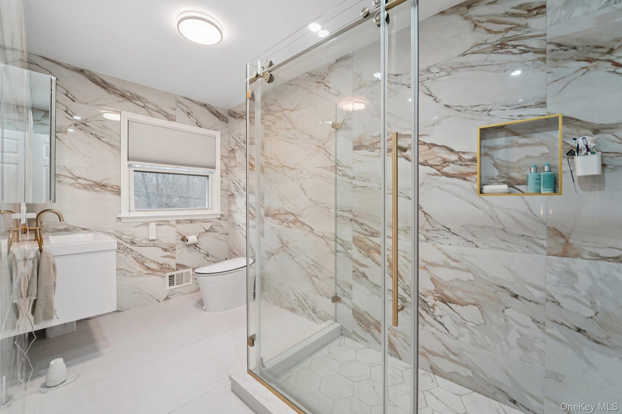 84 Townline Road Nanuet, NY 10954 - Photo 19 of 44 Full bath with vanity, tile walls, a marble finish shower, and stone wall