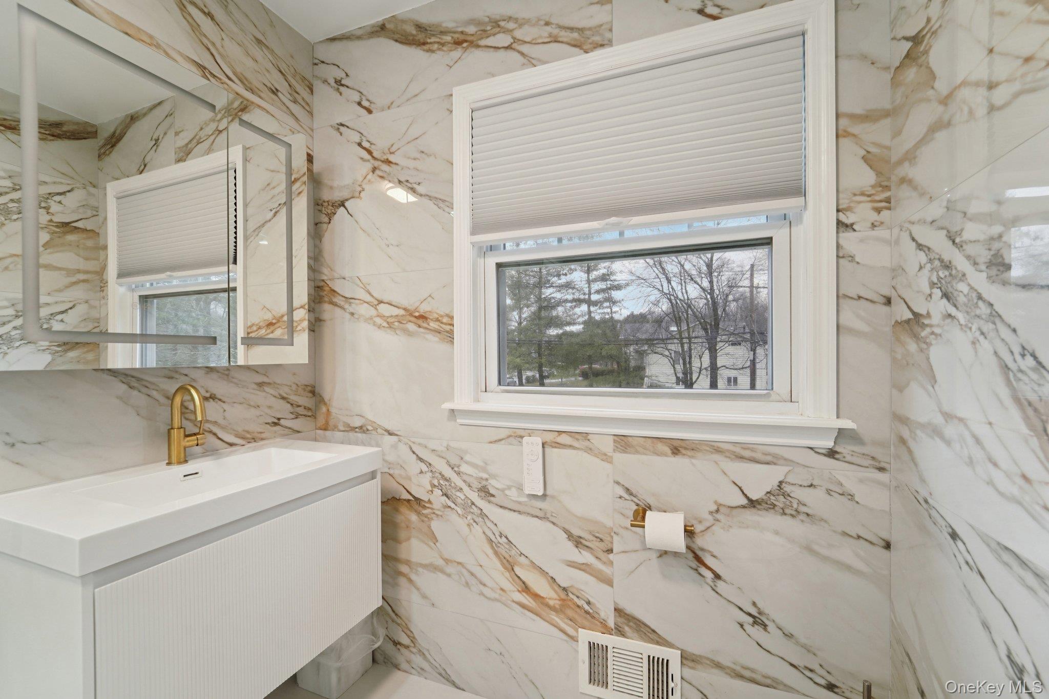 84 Townline Road Nanuet, NY 10954 - Photo 20 of 44 Bathroom featuring vanity and plenty of natural light
