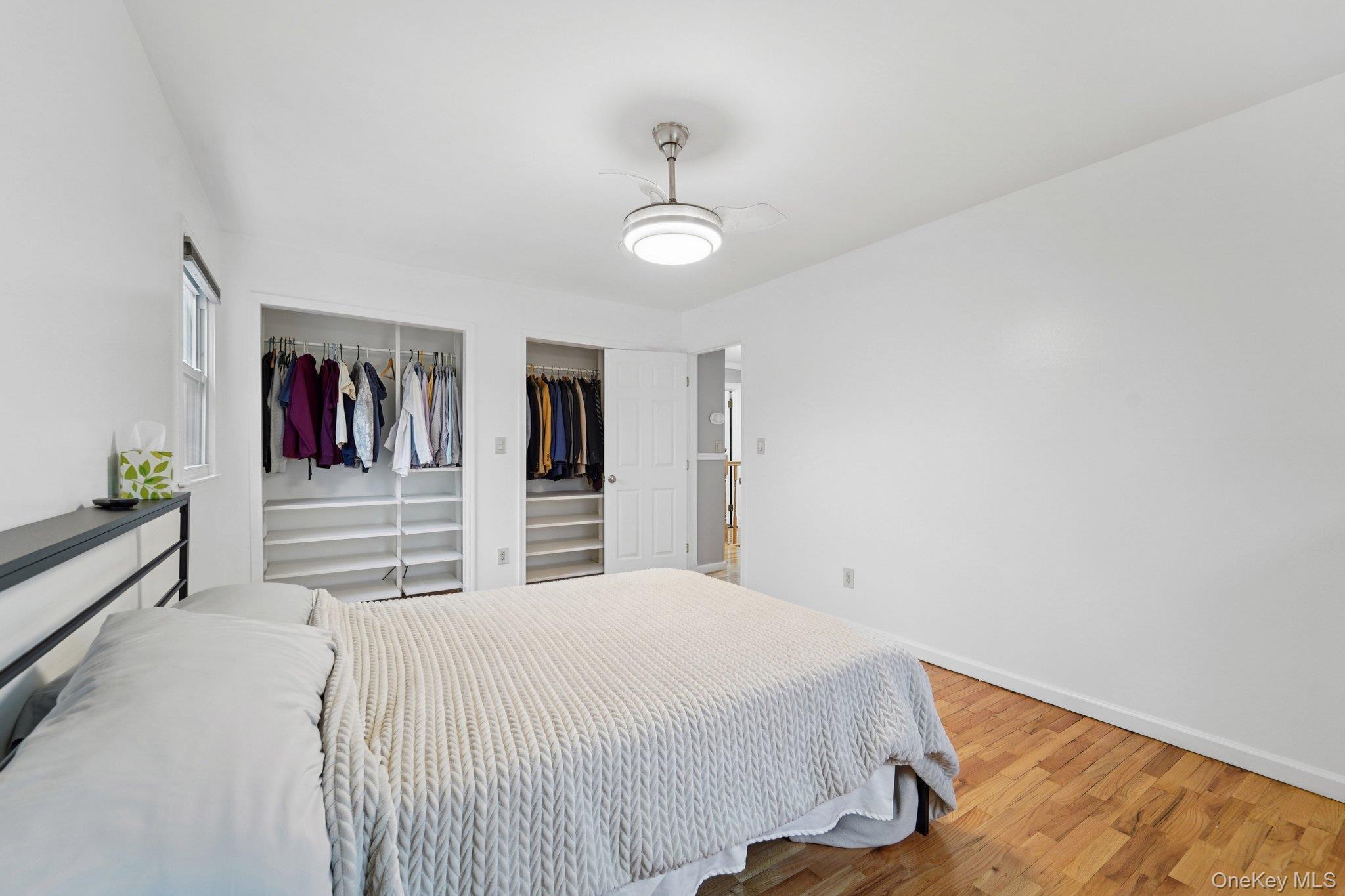 84 Townline Road Nanuet, NY 10954 - Photo 30 of 44 Bedroom with wood finished floors, two closets, and ceiling fan