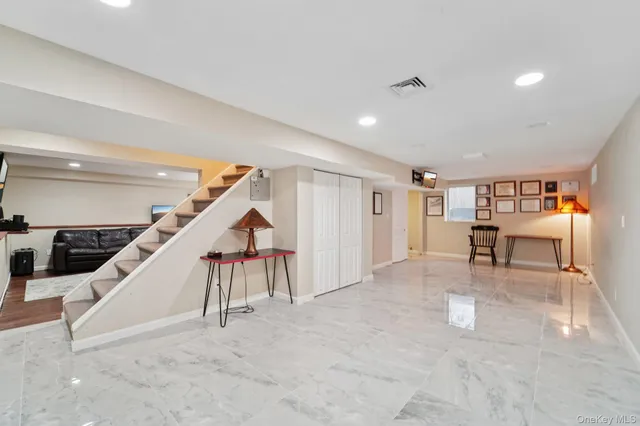 a view of staircase with furniture and stairs