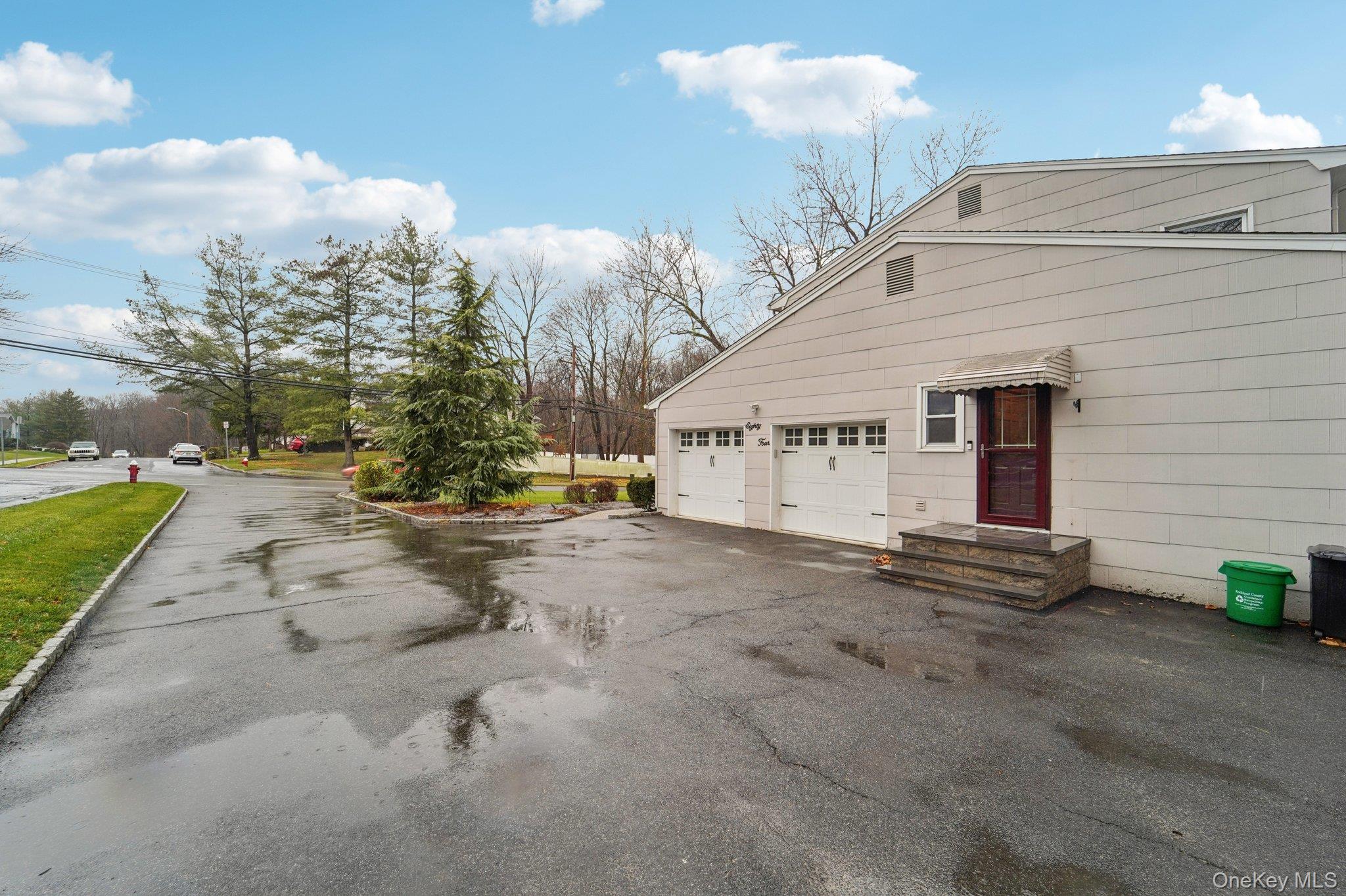 84 Townline Road Nanuet, NY 10954 - Photo 42 of 44 View of home's exterior featuring a garage and asphalt driveway