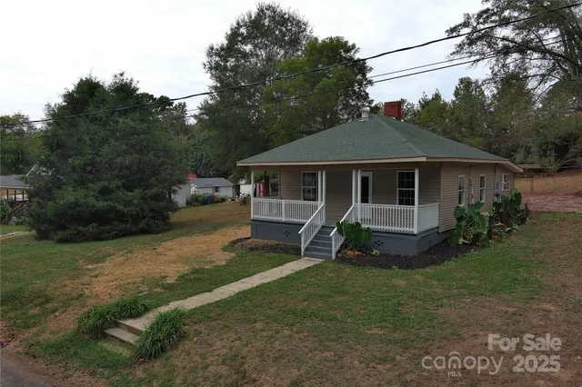 a house that has sitting area in backyard