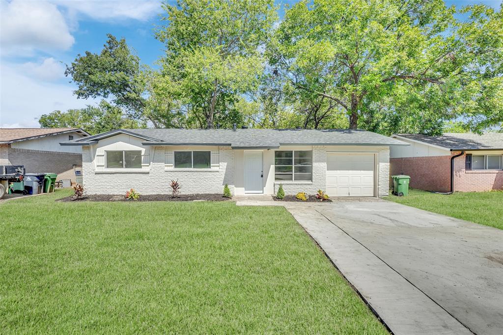 1507 East Lovers Lane Arlington, TX 76010 - Photo 1 of 18 a front view of house with a garden and patio