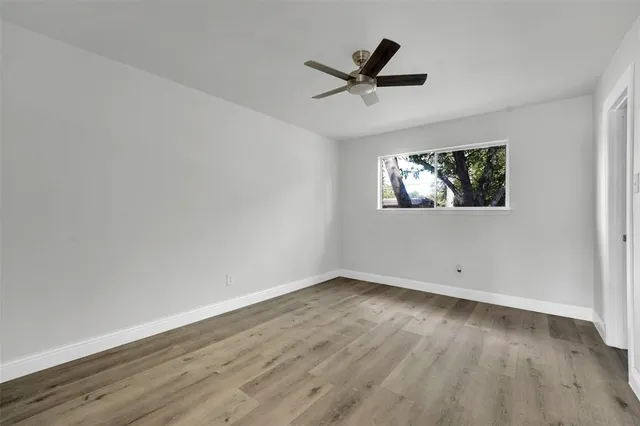 a bedroom with bed and window