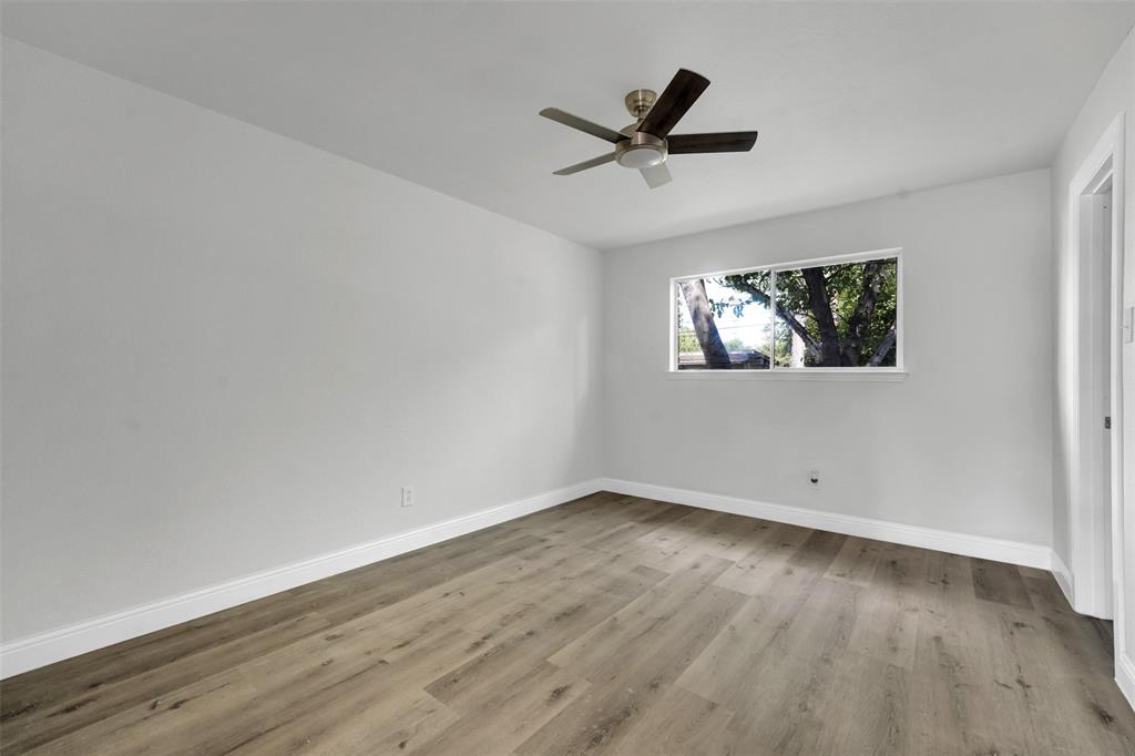 1507 East Lovers Lane Arlington, TX 76010 - Photo 10 of 18 a view of empty room with wooden floor and fan