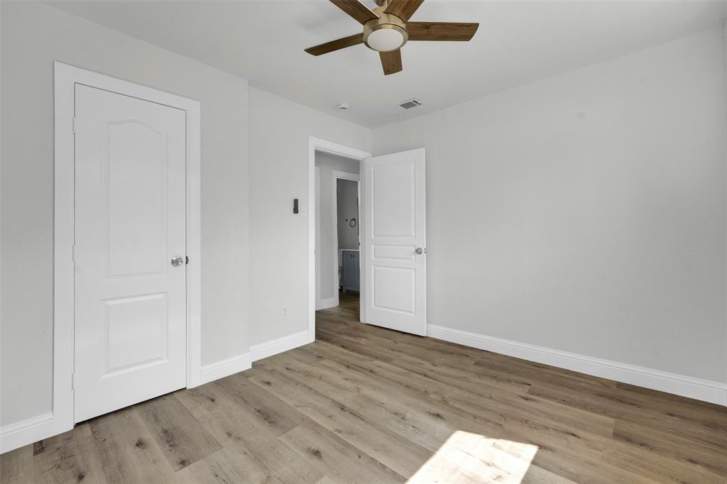 1507 East Lovers Lane Arlington, TX 76010 - Photo 16 of 18 a view of an empty room with wooden floor