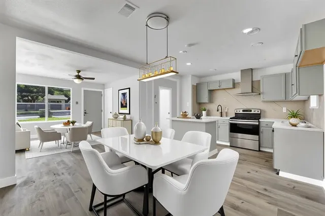 a view of a dining room with furniture window and wooden floor