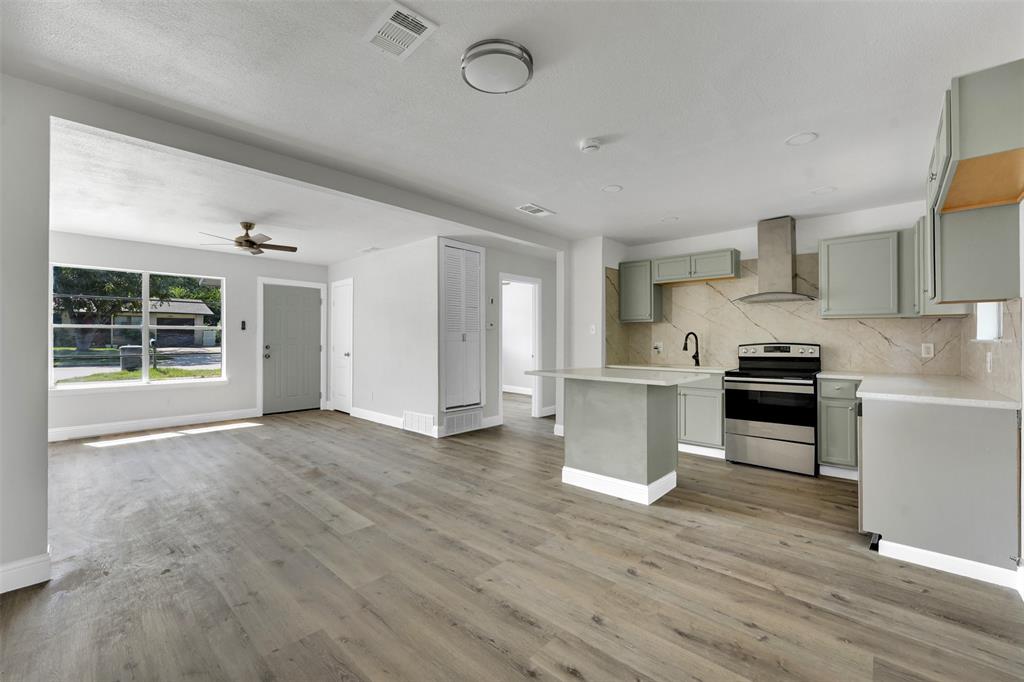 1507 East Lovers Lane Arlington, TX 76010 - Photo 18 of 18 a kitchen with granite countertop a stove and a refrigerator