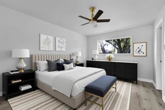 a kitchen with stainless steel appliances granite countertop a stove and white cabinets