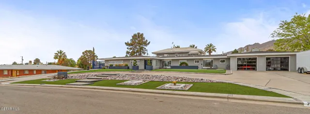a kitchen with stainless steel appliances granite countertop a stove and a kitchen island