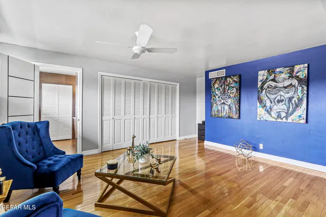a white toilet sitting in a bathroom next to a sink
