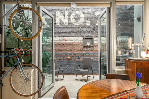 a view of a livingroom with furniture and entryway