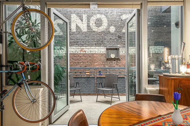 a view of a livingroom with furniture and entryway