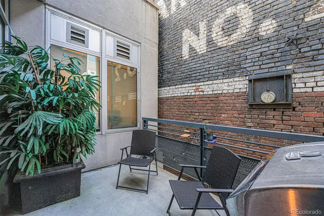 a view of house with outdoor seating area