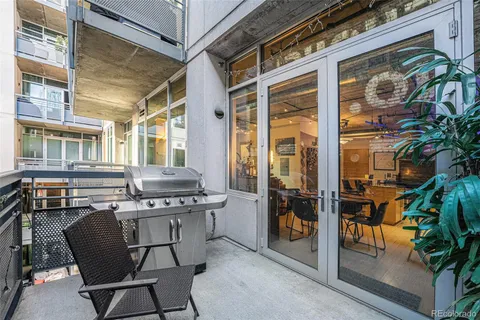 a view of a chairs and table in a patio
