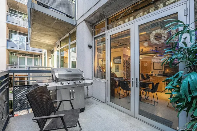 a view of a chairs and table in a patio