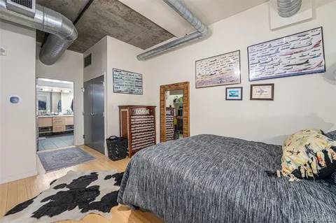 a bedroom with a bed and dresser