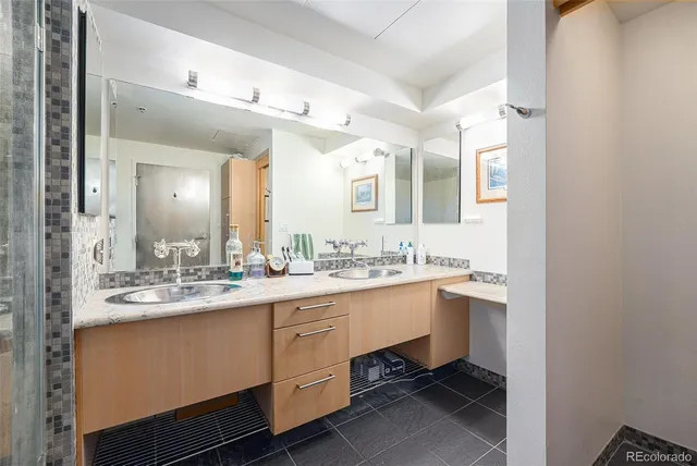 a bathroom with a sink and a mirror