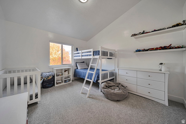 11730 South Shadow Lane Draper, UT 84020 - Photo 12 of 24 Bedroom featuring vaulted ceiling and light carpet