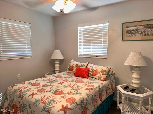 a bedroom with a bed and a lamp