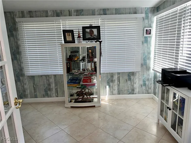 a view of workspace with wooden floor and windows